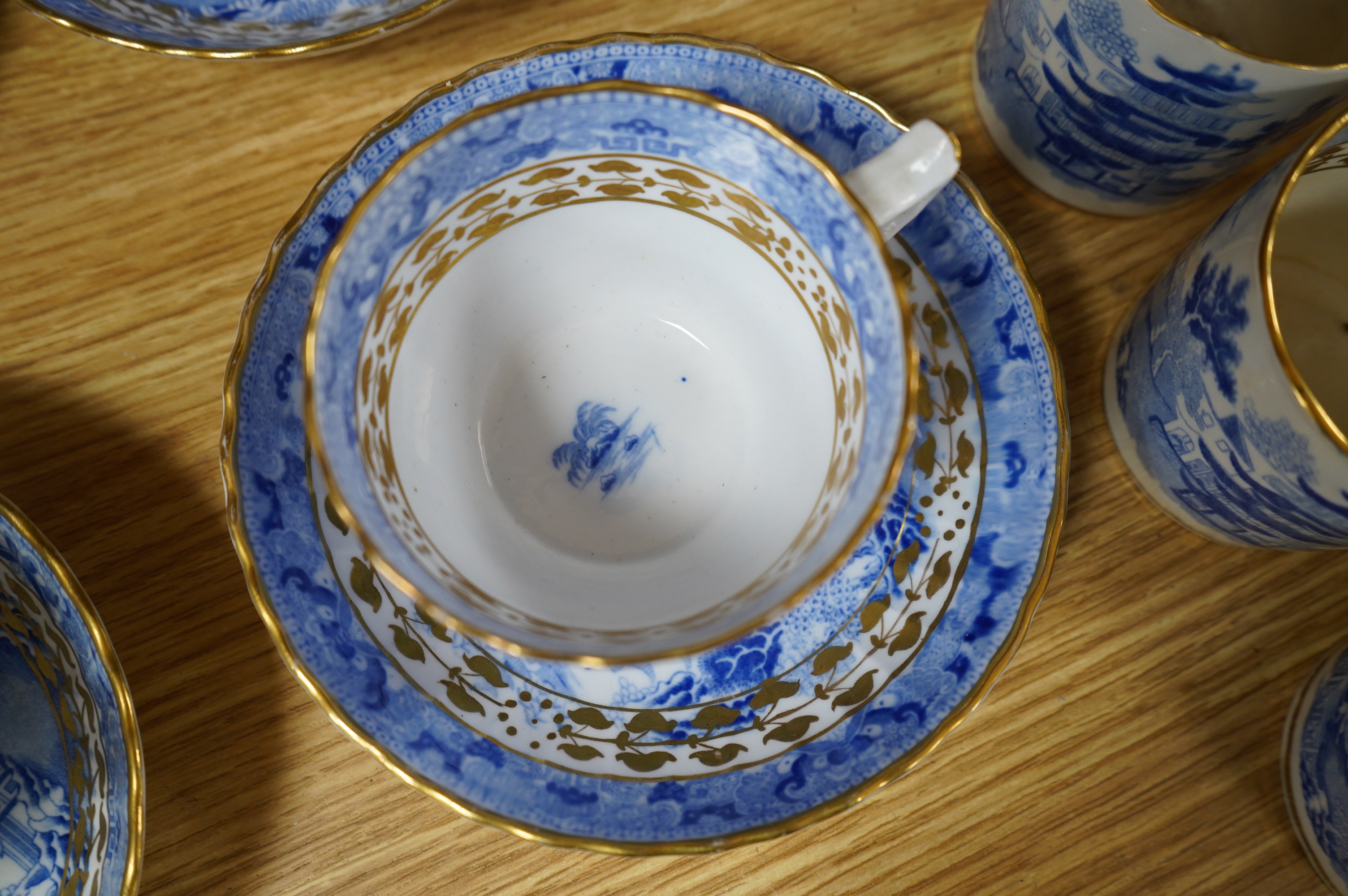 An early 19th century part coffee and tea set, probably Miles Mason, and a set of ten Derby dessert plates, 25cm in diameter. Condition - varies, poor to good